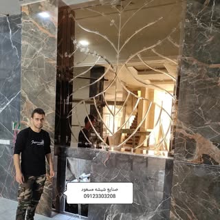 سازه شیشه ای و درب برقی مسعود ترکاشوند